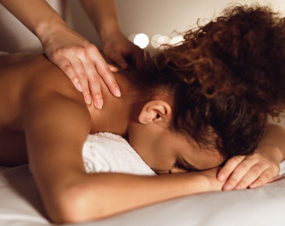 woman-enjoying-therapeutic-neck-massage-in-spa-GMDE84J.jpg